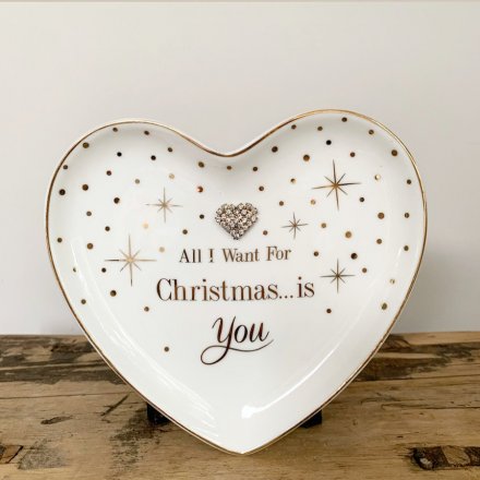 A heart shaped trinket dish with a heart gem and 'All I want for Christmas...is you' slogan.