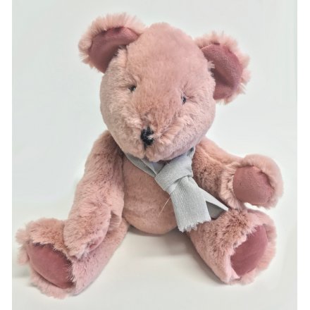A romantic pink teddy bear with scarf detail