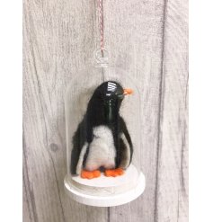 An adorable felt penguin displayed beautifully in a glass dome. A much loved seasonal decoration for the home.