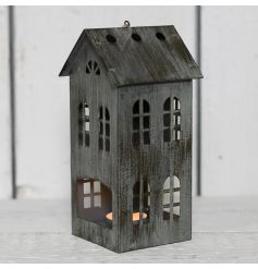  Complete with its worn down grey walls, this house shaped lantern will bring a delicate glow wherever it goes 