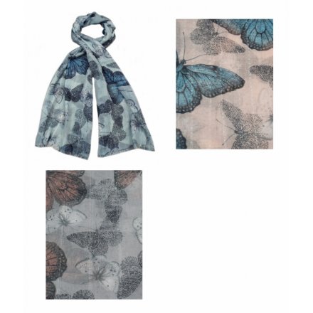 An assortment of 3 large butterfly design scarves. Each has a sequin glitter thread running through.