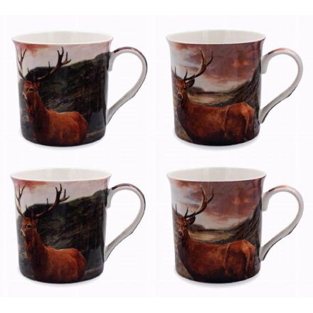 An assortment of 4 differently pictured ceramic stag themed mugs, 