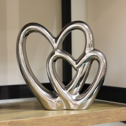 A chic silver double heart ornament. A classic and popular decorative.
