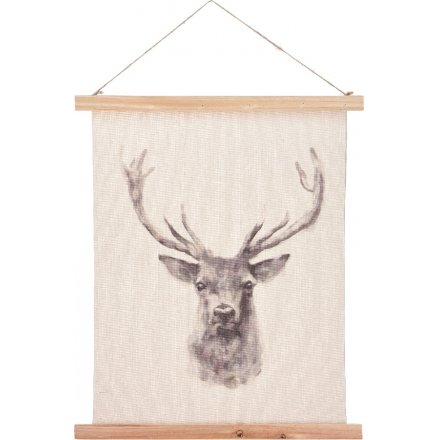 A beautiful assortment of hanging fabric canvases with a beautiful printed image of a stag on the centre 