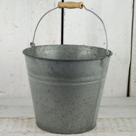 A medium sized traditional style double ridged zinc bucket greywashed