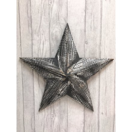 A black wooden Amish barn star