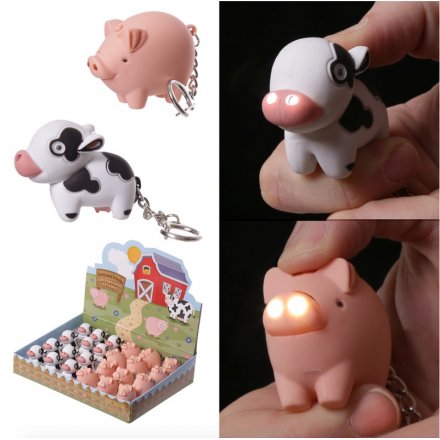  A fun farm styled display of cow and piggy keychains, complete with a light up nose and animal sounds
