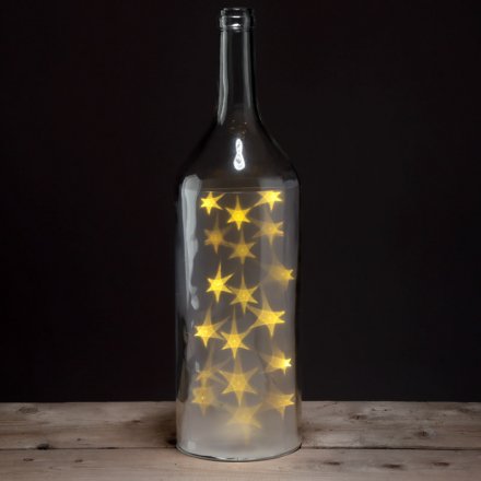  A stylish purple glass bottle with fitted warm glowing led lights 