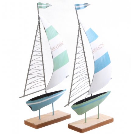  Bring a touch of the coast to your home with this nautical inspired assortment of metal boats 