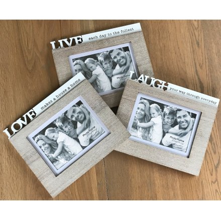 An assortment of 3 wooden frames with the popular 'live, laugh and love' quotes 