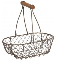 A grey wire oval basket with a long handle