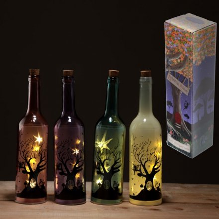  4 beautiful assorted led light bottles, complete with silhouette patterns