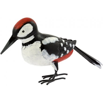 A quirky little perched woodpecker garden figure 