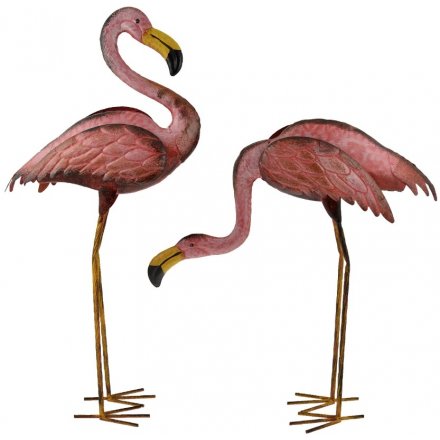 An assortment of 2 hand painted metal flamingo garden ornaments