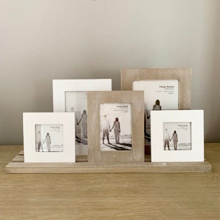 A beautifully distressed set of clustered wooden frames, 