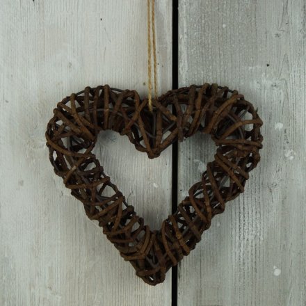 A 26cm natural tone rattan heart hanging wreath