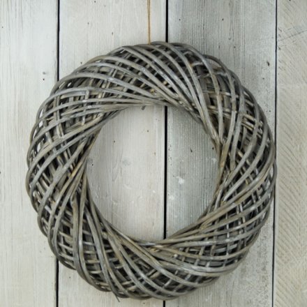  This stylish and simple woven wicker wreath will add a perfect rustic charm to any space 