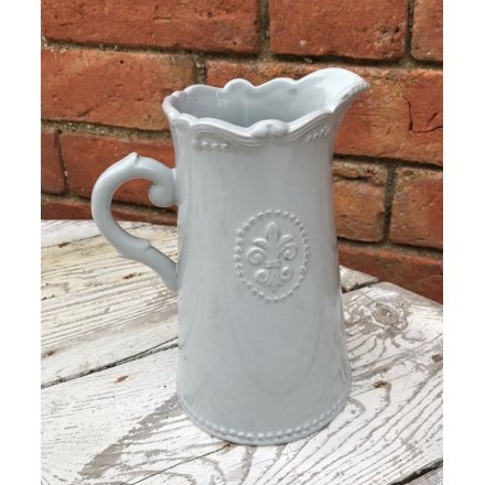 A beautifully smooth glaze finished ceramic jug, complete with a embossed Fleur De Lis