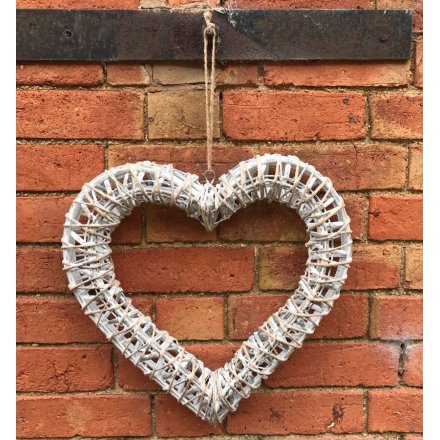 Decorate shabby chic home interiors all year round with this beautiful white woven willow heart hanging decoration.