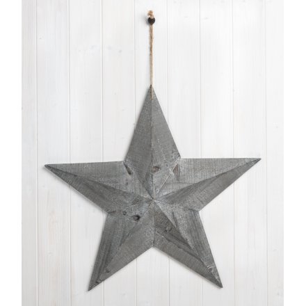 This extra large grey wood hanging barn star is sure to make a rough luxe look 