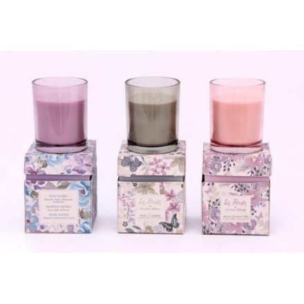 An assortment of 3 candle pots in floral gift boxes