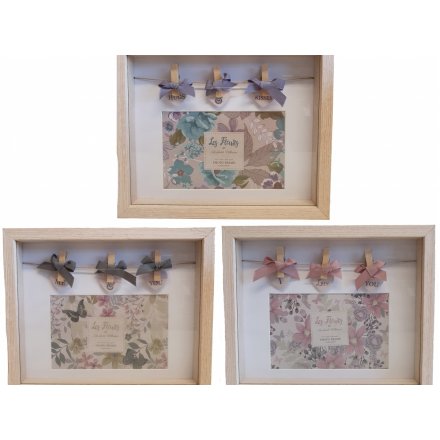 A sweet assortment of wooden peg frames, each complete with a colourful floral display and bow finishes 