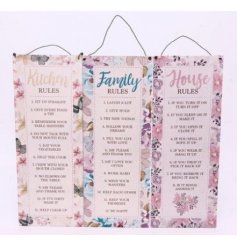 An assortment of 3 hanging metal signs with family, kitchen and house rules. Each has a pretty floral design.