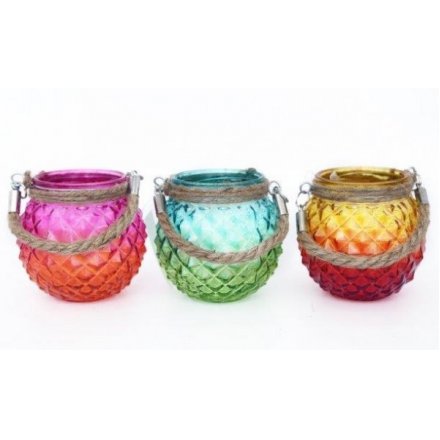  Bring a touch of the tropics to your home space with this groovy assortment of glass candle pots