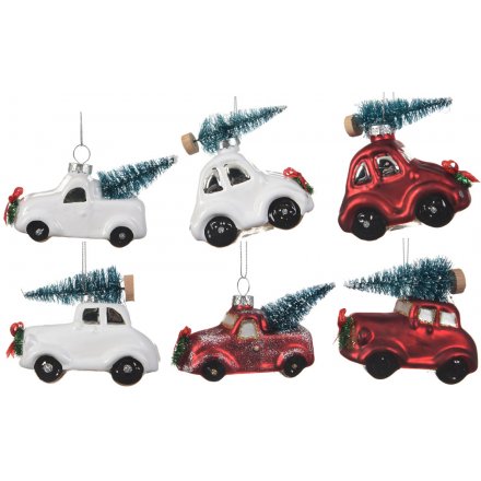  these tree carrying pickup trucks will look perfect in any Christmas tree display 