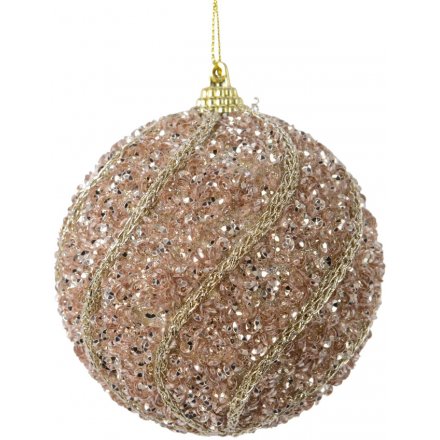 Hanging from its golden string, this rose pink glitter coated bauble is perfectly finished with an added gold pattern