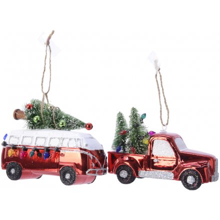 A shiny red camper van and a shiny red truck decorated with a dusting of glitter and colourful miniature fairy lights