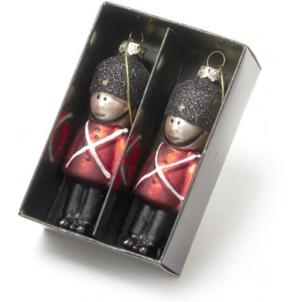 A beautiful set of glittered hanging soldiers set in their traditional red uniform 