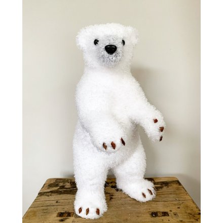 A beautiful standing polar bear decoration with a glittering coat. A stunning statement piece for the home