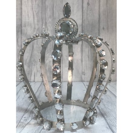 A bedazzled metal crown decoration with an added silver glam 
