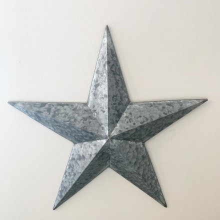  Set an Industrial Chic edge to your home decor this Christmas season with this worn and distressed metal star decoratio
