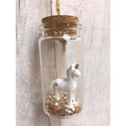 A magical white and gold glitter unicorn stands inside a miniature bottle with cork stopper 
