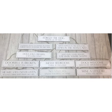 A large assortment of scripted plaques, set with a neutral grey and white tone 