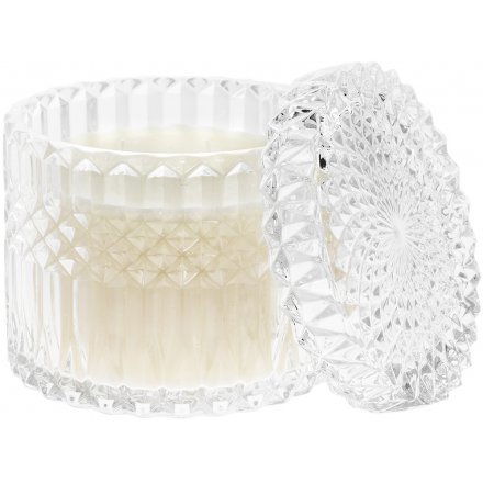 A beautifully patterned glass candle pot with a crystal inspired embellishment and pomegranate scented wax centre 