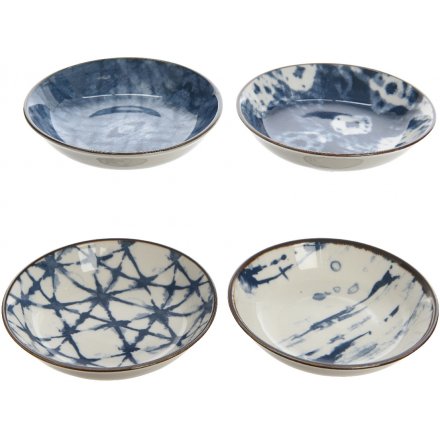 an assortment of 4 mini bowls, each set with its own blue toned pattern 