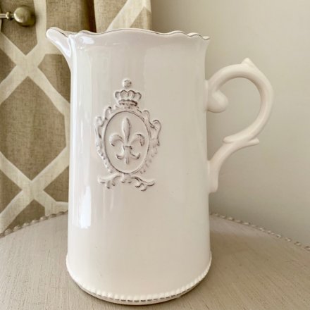  A beautifully smooth glaze finished ceramic jug, complete with a embossed Fleur De Lis