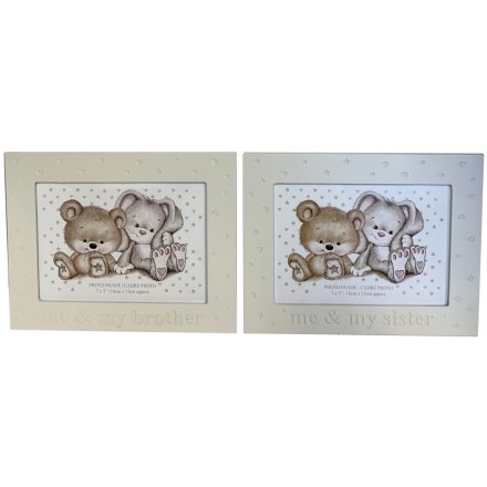 Two assorted silver photo frames in and brother\sister and me design