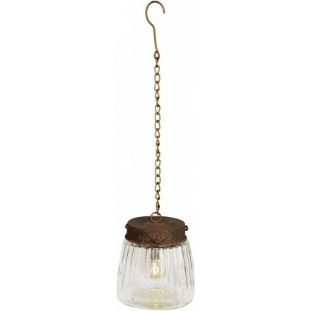 A rustic style hanging lamp in the style of a vintage mason jar. 