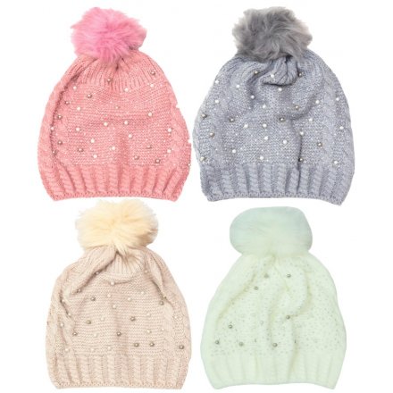 A mix of 4 cosy and stylish knitted hats with pearl and stone detailing and a pom pom.