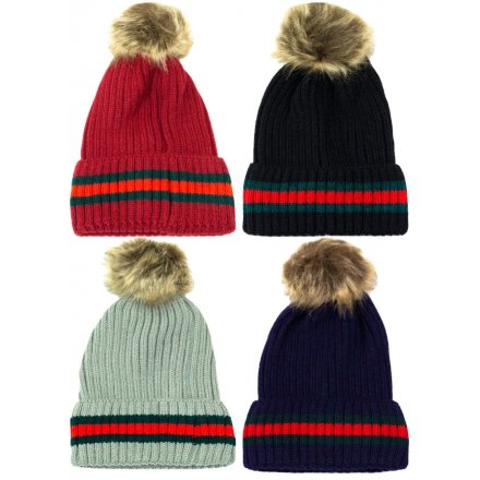 An assortment of 4 cable knit hats with a contrasting stripe detail and fluffy pom pom.