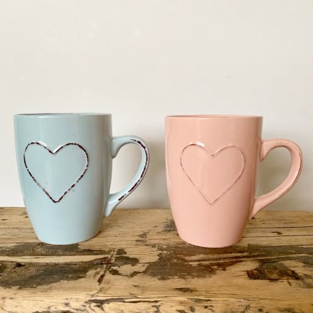  A charming assortment of pastel pink and blue toned mugs with an added embossed heart feature 