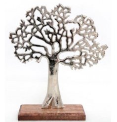 A chic decorative tree ornament with a silver tarnished finish. Set upon a chunky wooden base.