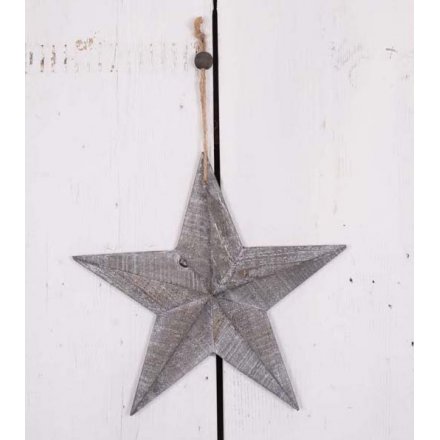 A rustic style 3D wooden star with a grey washed finish. Complete with rustic hanger and bead.