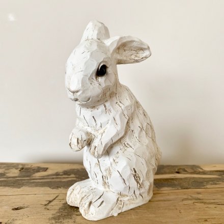 A charming polyresin rabbit decoration with a carved wood effect finish. A shabby chic decoration for the home.