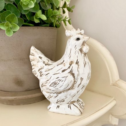 A shabby chic style chicken ornament with a carved wood effect finish. A charming interior accessory for the home.
