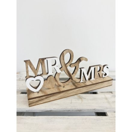 A chic 3D tabletop Mr & Mrs wedding sign with hearts and LED lights.